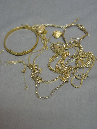 A collection of gold and gilt metal chains etc