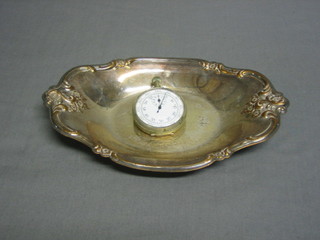An embossed oval silver plated dish 8 1/2" and a military issue stop watch