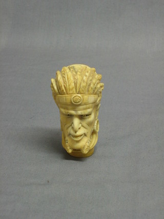 A 19th Century carved ivory walking stick handle in the form of a head and shoulders portrait of a native Indian 3"