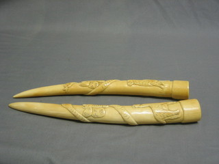 2 carved ivory tusks 12"