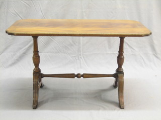 A Georgian style rectangular mahogany coffee table with brass inlay raised on scroll supports 32"