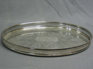 An engraved oval silver plated tea tray with pierced gallery 18"