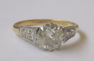 A lady's 18ct gold solitaire diamond engagement ring set 2 diamonds 2 each shoulder