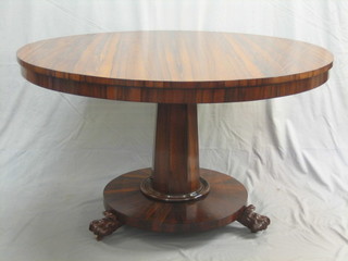 A Victorian circular rosewood snap top breakfast table, raised a on turned chamfered column with circular base 47"