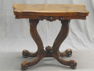 A 19th Century Scotts figured walnut card table of serpentine outline, raised on 4 scrolled supports 36"