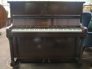 An upright piano forte, over strung, iron framed and under dampen by Maxwell contained in a mahogany case