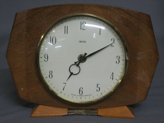 A 1950's Smiths battery operated mantel clock contained in a walnut case