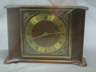 A 1960's Smiths mantel clock with gilt metal chapter ring and Roman numerals contained in a walnut case