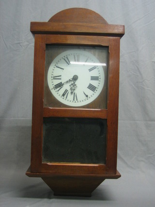 A striking wall clock with painted dial contained in a mahogany case