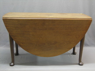 A George III mahogany oval gateleg dining table raised on pad feet 48"