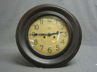 A striking wall clock with 10" circular painted dial marked  Junghans 1, contained in a mahogany case