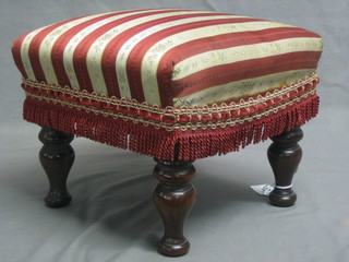 A 19th Century square mahogany stool with upholstered seat, raised on turned supports 10"