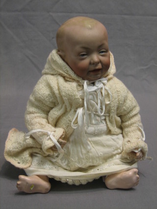 A Victorian porcelain headed doll with open mouth and open eyes, head incised K R 15 100 13"