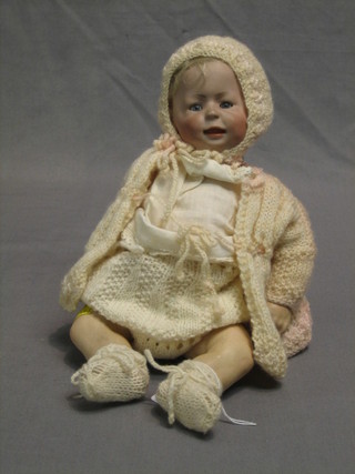 A 19th Century German porcelain headed doll with open and shutting eyes, open mouth, head incised 4, with articulated body 10"