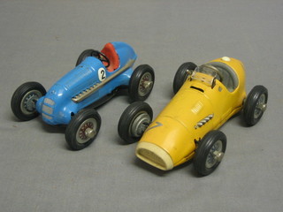 A Schuco pressed tin plate metal model car Studio 1050 together with Schuco 1070 Grand Prix racers (2)
