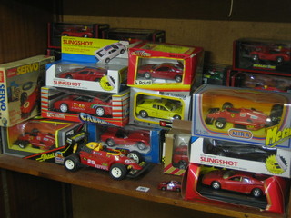 A large collection of various model racing cars etc