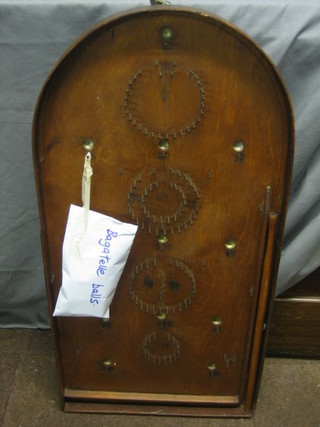 An old wooden bagatelle game