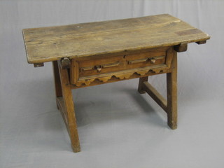 A 19th Century Continental pine trestle table, fitted a drawer 46"