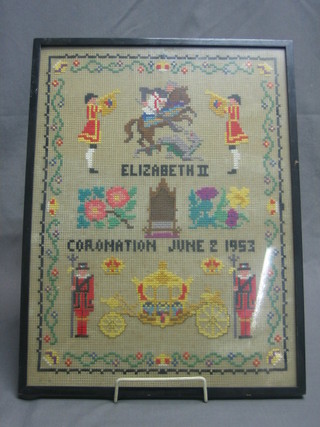 A 1950's wool work sampler to commemorate the Coronation decorated State Trumpeters, St George, The Royal Coach etc 16" x 12"