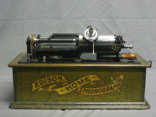 An Edison phonograph, October 13th 1892 patent, contained in an oak case together with 36 various phonograph cylinders contained in a fibre box 300-400 