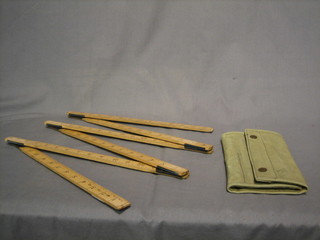 A wooden 6' folding gauge and a WWII War Office issue drawing set contained in a webbing case (complete)