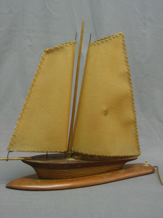 An Art Deco wooden table lamp in the form of a yacht 20"