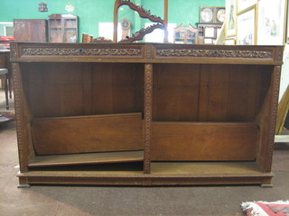 A Victorian Continental carved oak bookcase, the top fitted 2 long drawers, raised on bracket feet 71"