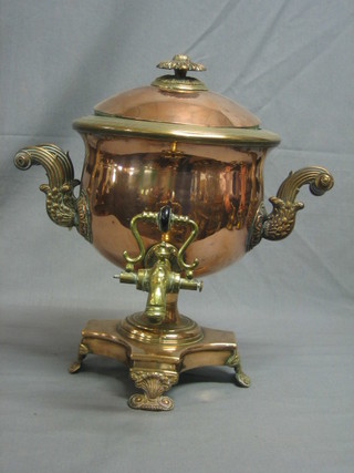 A 19th Century copper twin handled Samovar raised on a triform base