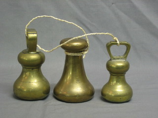 A 7lbs Avery bell weight and 2 other bell weights