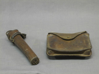 A leather hunting horn holster 8 1/2" and a WWI chain saw contained in a leather case