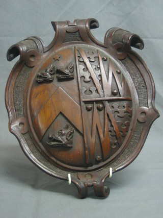 A Victorian carved oak heraldic shield 14"