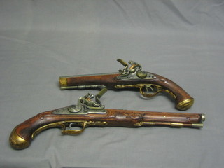 A reproduction double barrel flint lock pistol and 1 other
