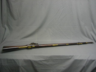 An 18th Century flintlock musket, the 39" circular barrel with 4 and various proof marks, the lock crowned GR and marked Tower, complete with ram rod