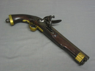 An 18th Century flintlock pistol, the 9" circular barrel with crowned CP proof mark and marked APX-979-8X-73, the lock with crown and rampant lion with stirrup ram rod, brass fittings