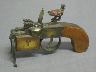 A Dunhill tinder petrol reproduction flintlock table lighter, the base marked Dunhill tinder petrol