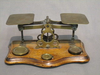 A pair of brass letter scales