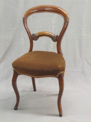 A set of 4 Victorian mahogany balloon back dining chairs with shaped mid rails, raised on French cabriole supports