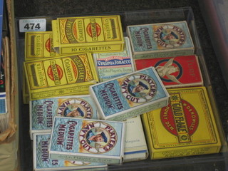 A collection of various empty cigarette packets 