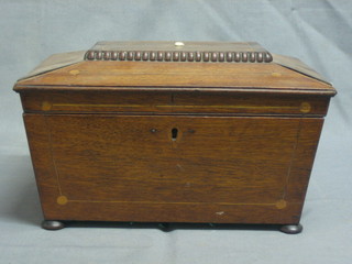 A 19th Century mahogany sarcophagus shaped workbox with hinged lid and inlaid decoration, raised on bun feet 12"
