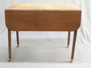 A Georgian mahogany Pembroke table, fitted a frieze drawer and raised on square tapering supports ending in brass caps and castors 36"