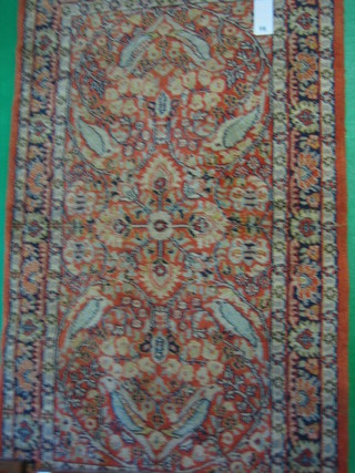 A contemporary peach coloured Persian rug with of floral design 62" x 35"