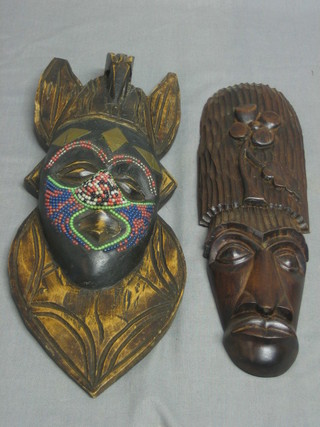 An African wooden mask with bead work decoration 15" and 1 other 13"