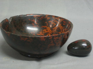 A circular marble bowl 8" (chipped) and a model of an egg
