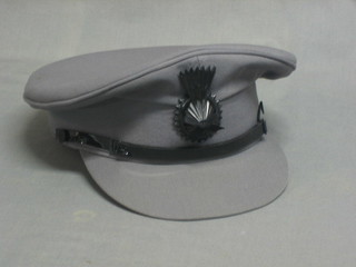 A grey chauffer's cap