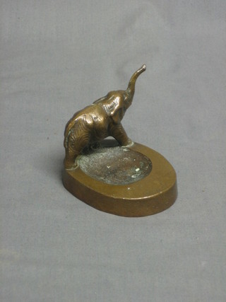 A bronze ashtray surmounted by an elephant 4"