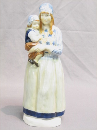 A  Dutch? porcelain figure of a standing bonnetted lady and child 13", the base with crown cypher mark 
