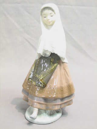 A Lladro figure of a standing lady 10"
