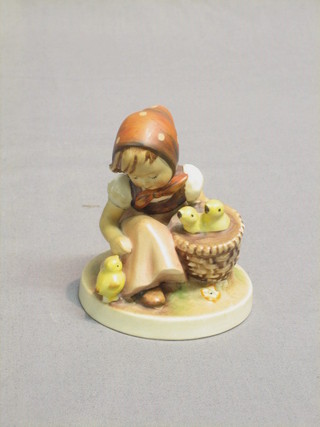A Goebal figure of a seated girl with basket of chicks 4"