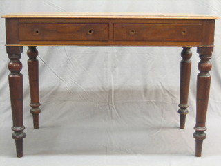 A 19th Century mahogany side table fitted 2 drawers and raised on turned supports 42"