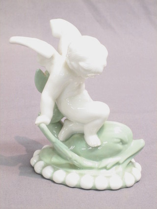 A Minton porcelain figure of a cherub riding a dolphin (f), base marked 105 6"